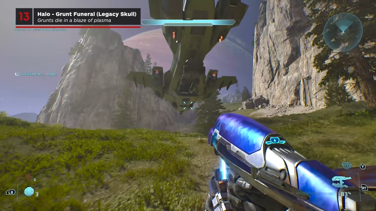The segmented metallic spire beside the underground rescue structure.
