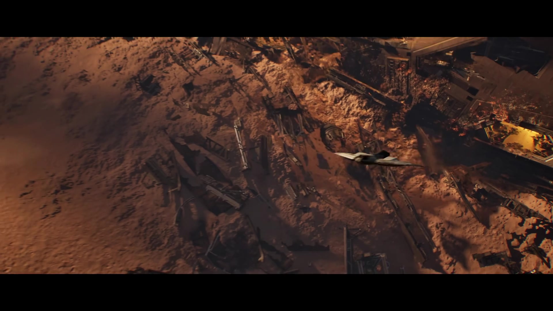 A soldier observing a chaotic battlefield with alien structures in background