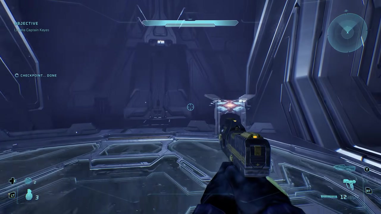 The lift arrival and shielded enemy around the first corner.