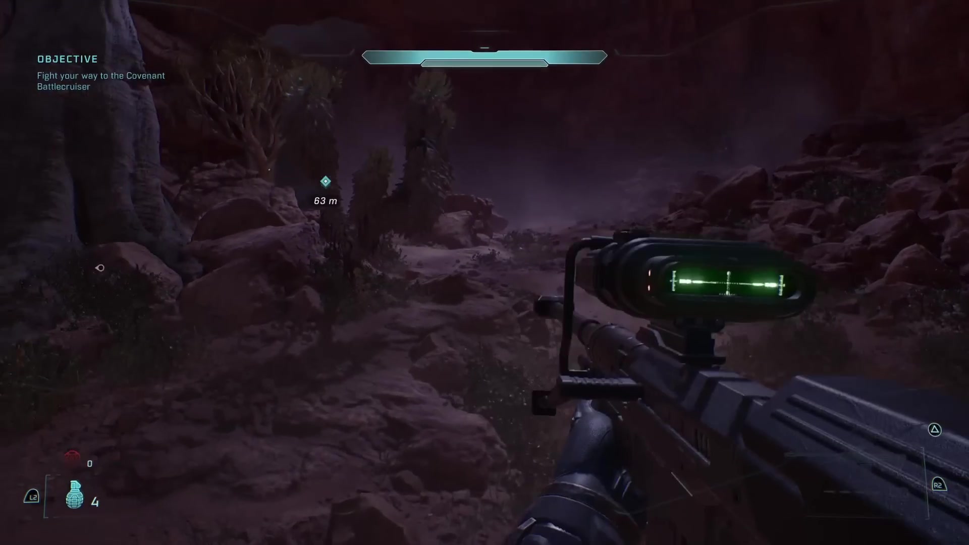 A dark rocky campaign firefight with the weapon scope, objective marker, and full gameplay HUD visible.